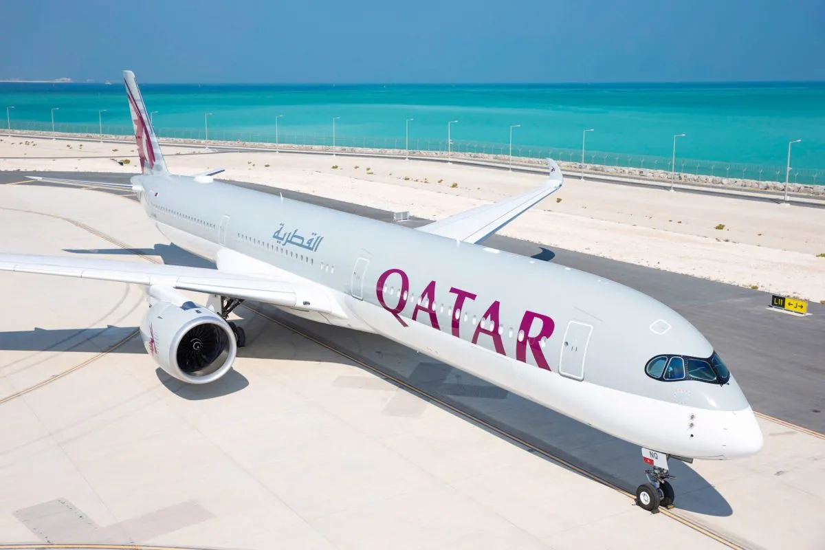 Qatar Airways Boeing 777X widebody jet at Boeing production facility, part of record-breaking aircraft order.