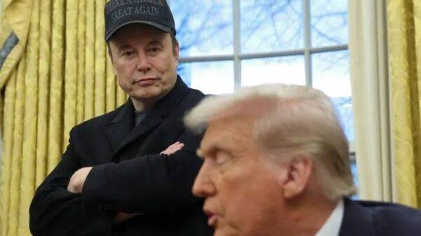 Screenshot of Elon Musk replying “Yes” to a viral X post calling for Trump’s impeachment